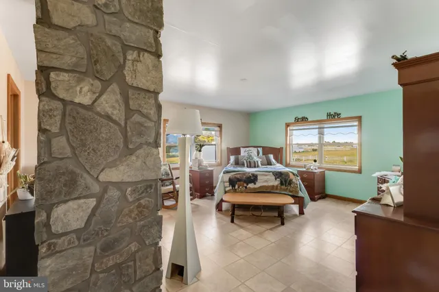 a bed room with a bed and a window