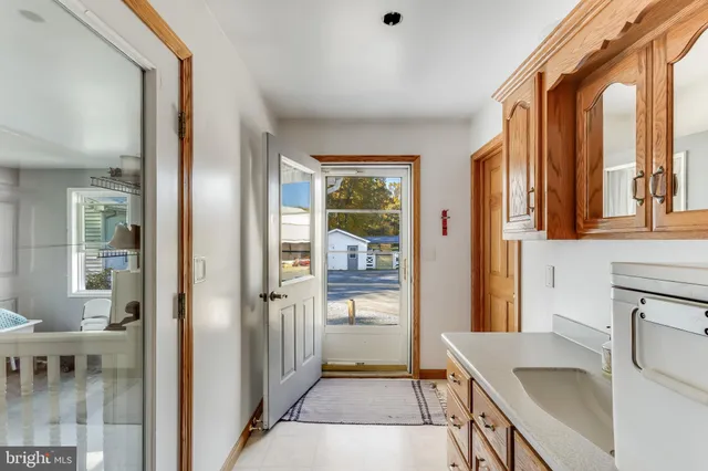 a front view of a house with swimming pool and porch