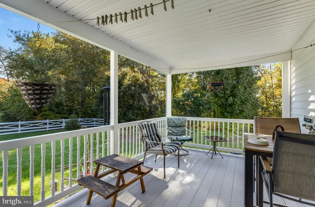 a view of house with outdoor space and car parked