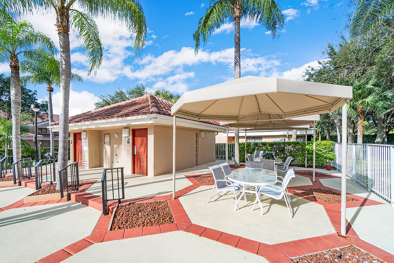17348 Boca Club Boulevard, Unit 607 Boca Raton, FL 33487 - Photo 15 of 16 030-17348BocaClubBlvd-BocaRaton-FL-table