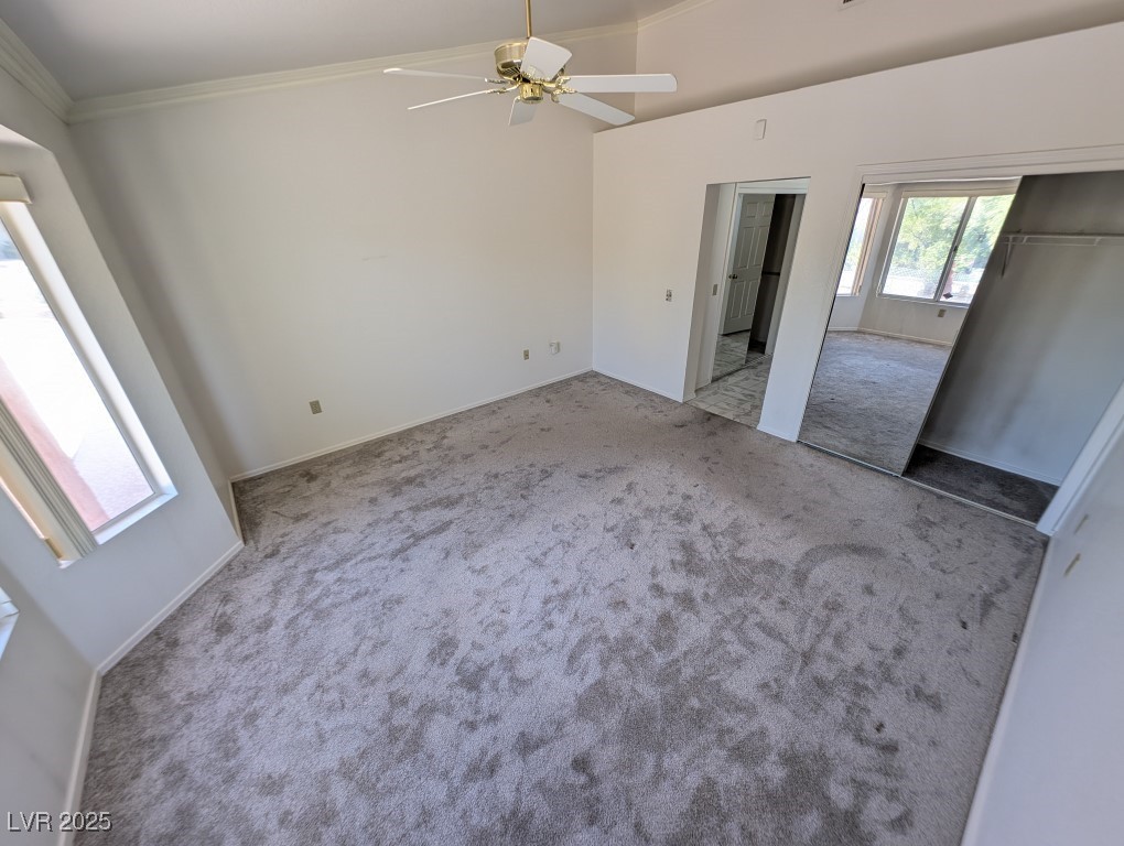 2504 Sunup Drive Las Vegas, NV 89134 - Photo 12 of 27 Unfurnished bedroom featuring carpet floors, a closet, and a ceiling fan
