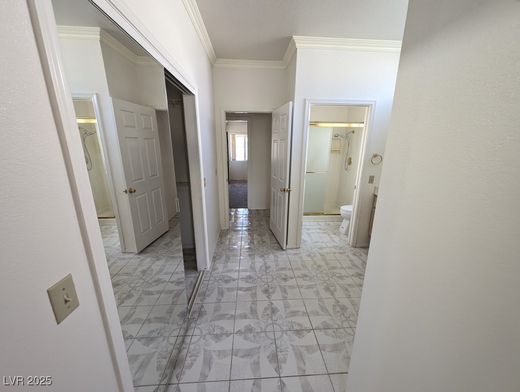 2504 Sunup Drive Las Vegas, NV 89134 - Photo 13 of 27 Hallway featuring ornamental molding