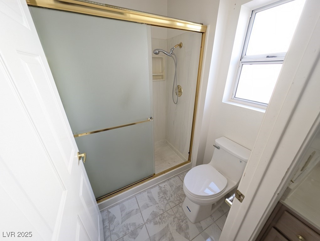 2504 Sunup Drive Las Vegas, NV 89134 - Photo 15 of 27 Bathroom with a stall shower and toilet