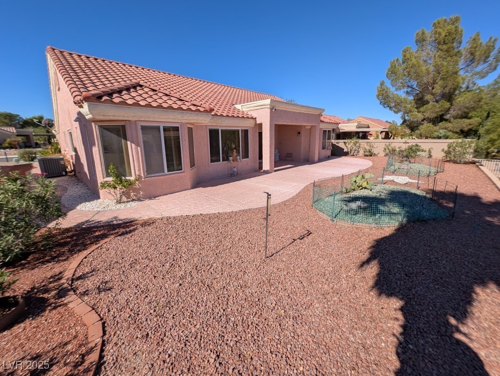 2504 Sunup Drive Las Vegas, NV 89134 - Photo 24 of 27 Rear view of house featuring a patio, stucco siding, and a tile roof
