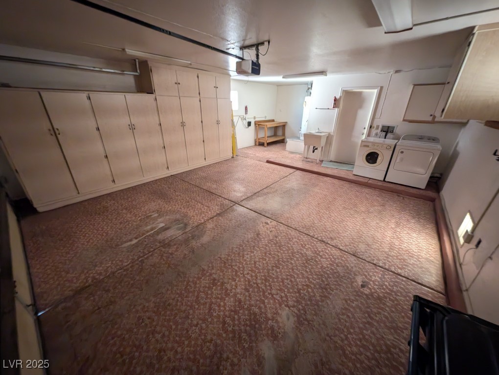 2504 Sunup Drive Las Vegas, NV 89134 - Photo 27 of 27 Garage featuring washing machine and clothes dryer and a garage door opener