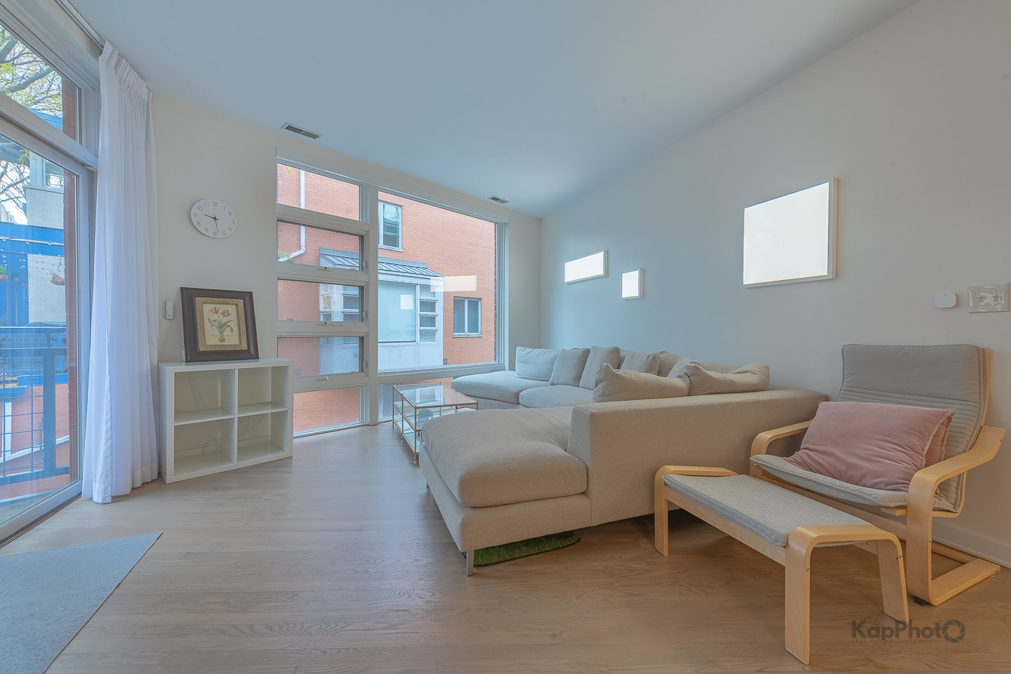 1151 West Washington Boulevard, Unit 125 Chicago, IL 60607 - Photo 11 of 28 a living room with furniture and a floor to ceiling window