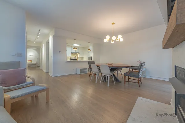 a dining room with furniture and chandelier