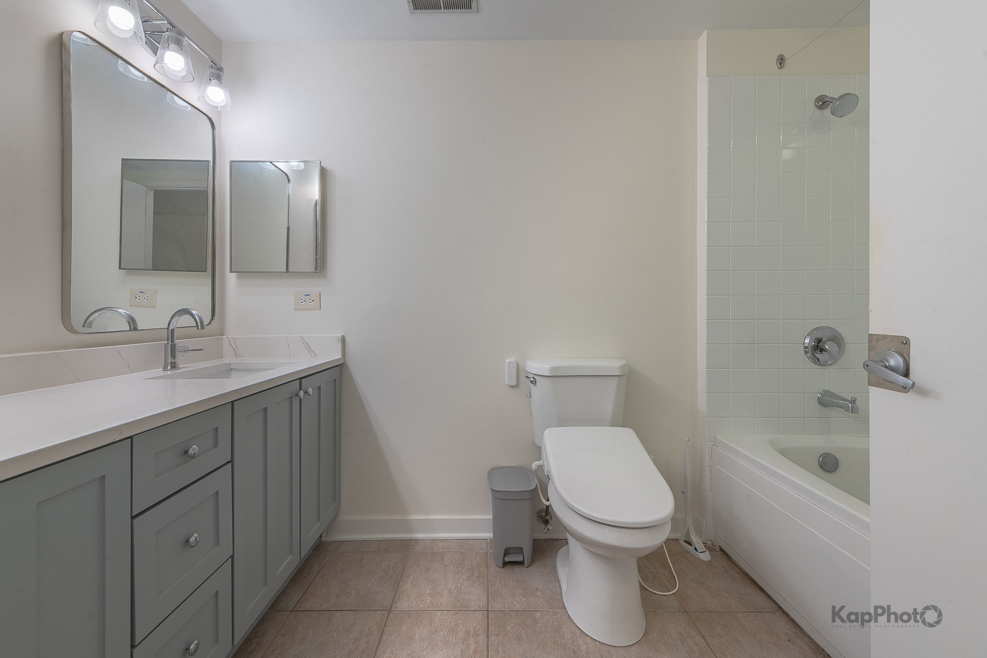 1151 West Washington Boulevard, Unit 125 Chicago, IL 60607 - Photo 25 of 28 a bathroom with a toilet sink and mirror