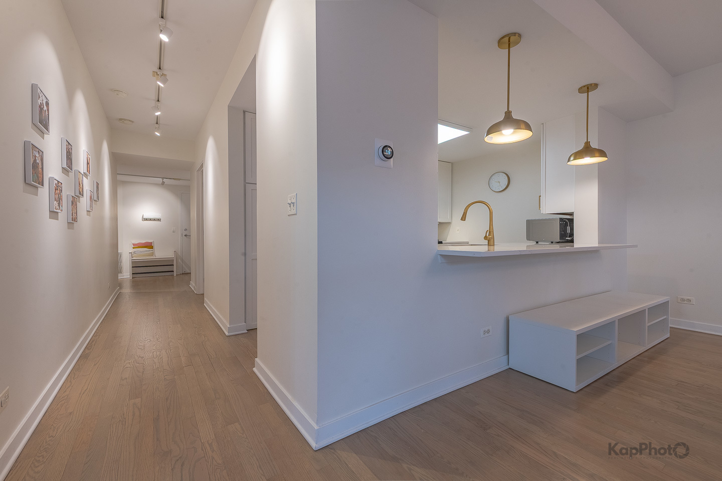 1151 West Washington Boulevard, Unit 125 Chicago, IL 60607 - Photo 4 of 28 a view of a room with wooden floor and a chandelier