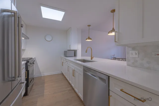 a kitchen with a sink and cabinets