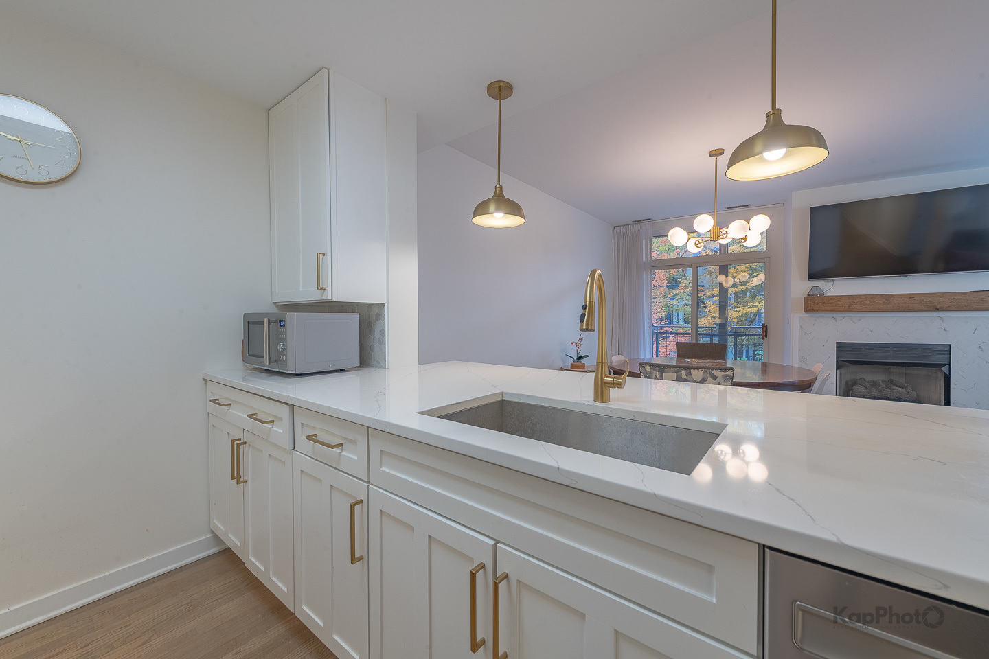 1151 West Washington Boulevard, Unit 125 Chicago, IL 60607 - Photo 7 of 28 a kitchen with a sink and chandelier
