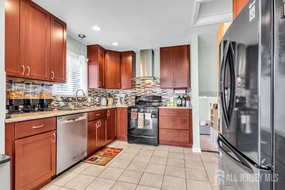 14 Academic Road East Brunswick, NJ 08816 - Photo 13 of 28 a kitchen with stainless steel appliances granite countertop a refrigerator and a stove top oven