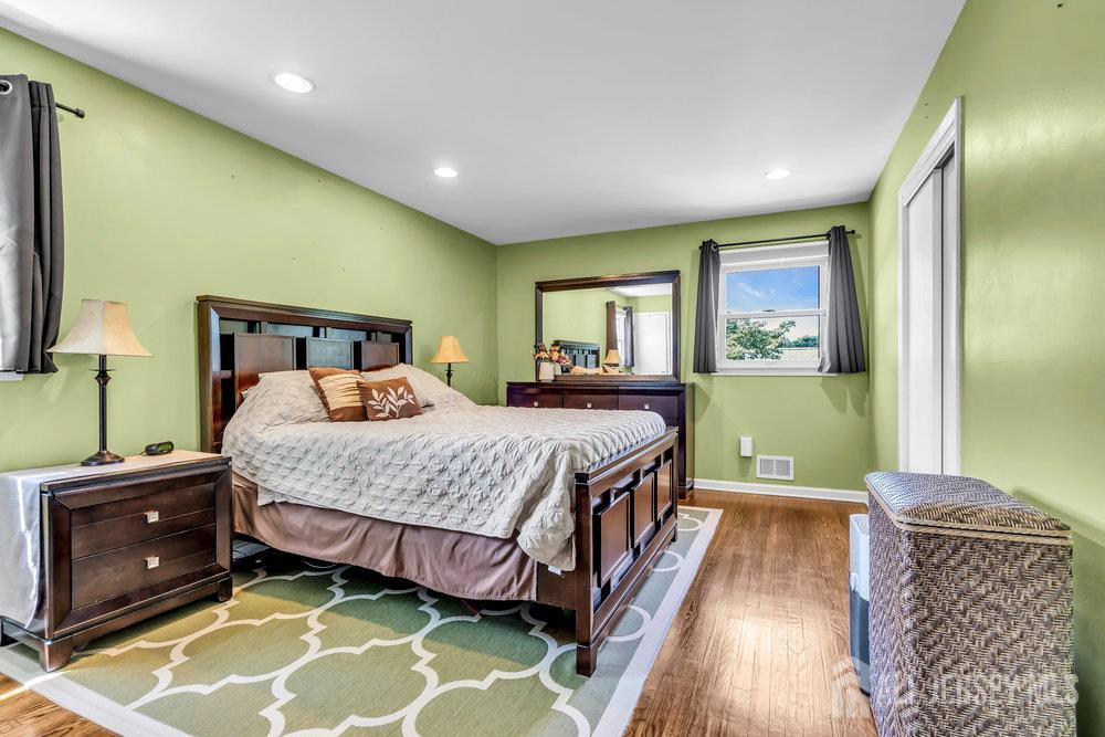 14 Academic Road East Brunswick, NJ 08816 - Photo 16 of 28 a bedroom with a bed and a dresser next to a window