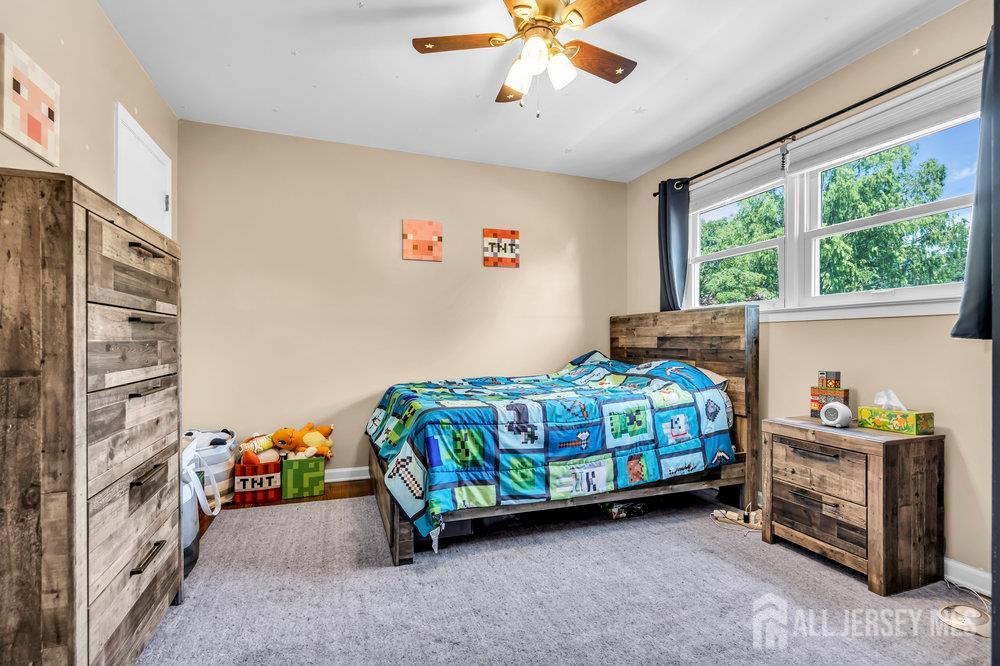 14 Academic Road East Brunswick, NJ 08816 - Photo 20 of 28 a bedroom with a bed and a window