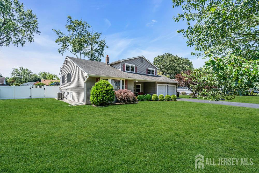 14 Academic Road East Brunswick, NJ 08816 - Photo 2 of 28 a front view of a house with a yard