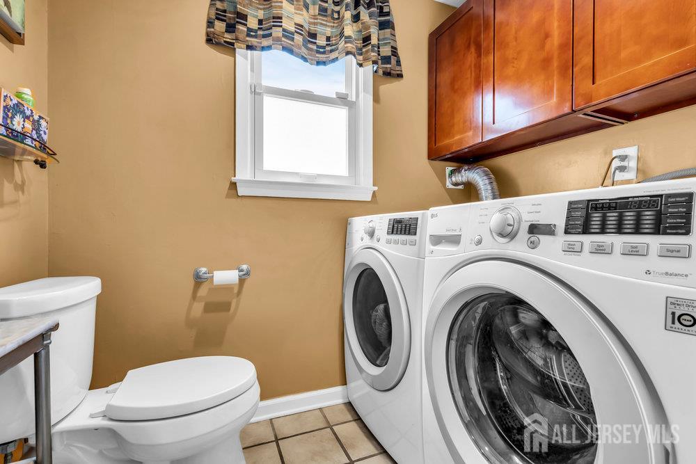 14 Academic Road East Brunswick, NJ 08816 - Photo 22 of 28 a bathroom with a toilet a sink and a window