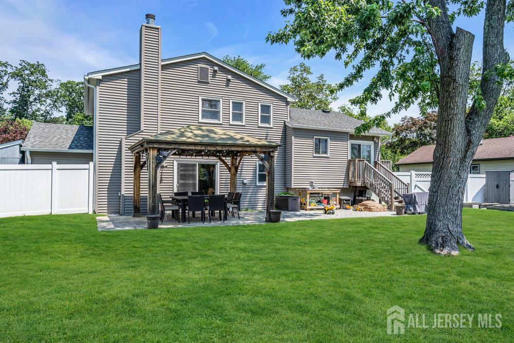 14 Academic Road East Brunswick, NJ 08816 - Photo 26 of 28 a view of a house with a yard and sitting area