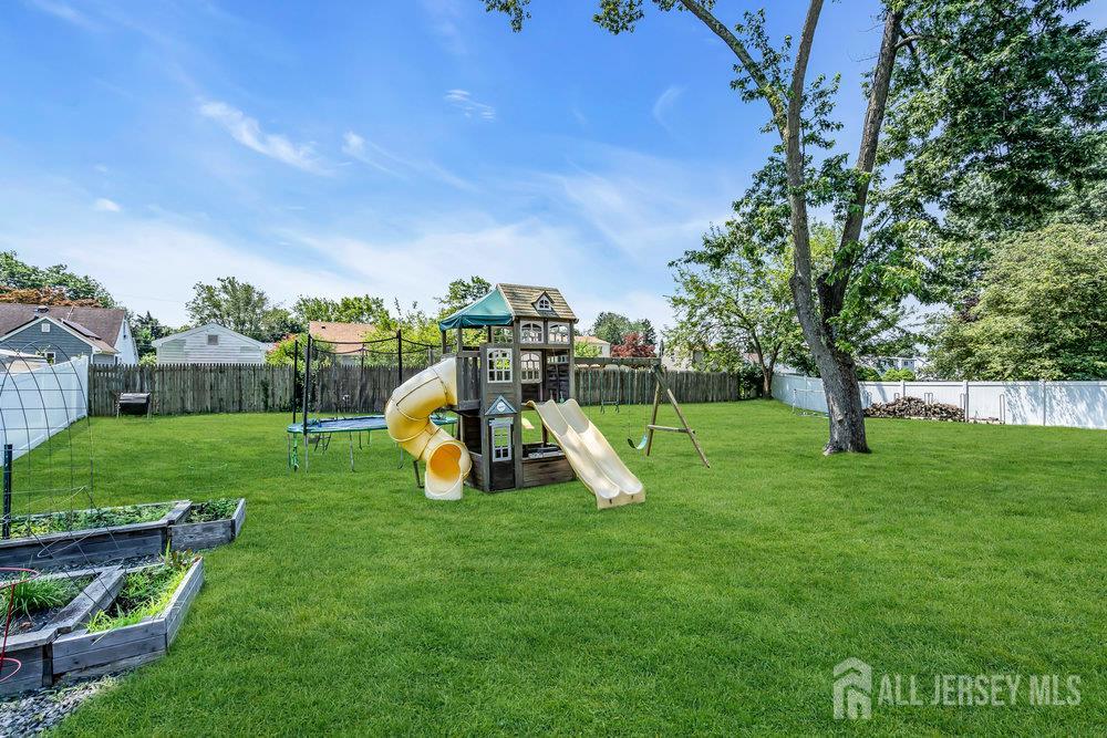 14 Academic Road East Brunswick, NJ 08816 - Photo 27 of 28 a view of a garden with a slide