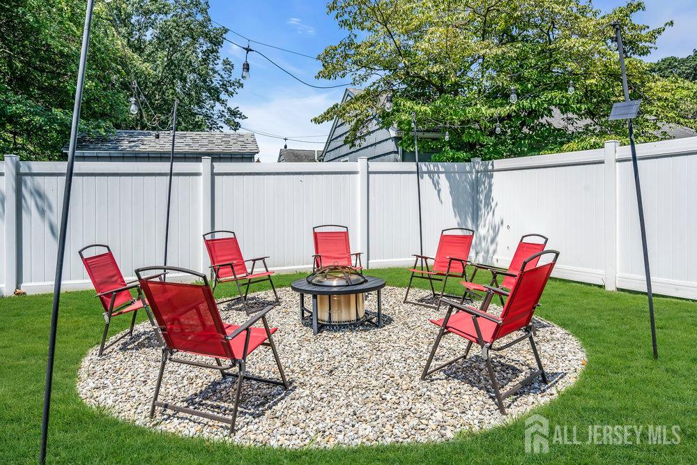 14 Academic Road East Brunswick, NJ 08816 - Photo 28 of 28 a patio with a table and chairs