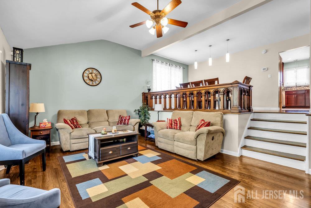 14 Academic Road East Brunswick, NJ 08816 - Photo 7 of 28 a living room with furniture and a rug