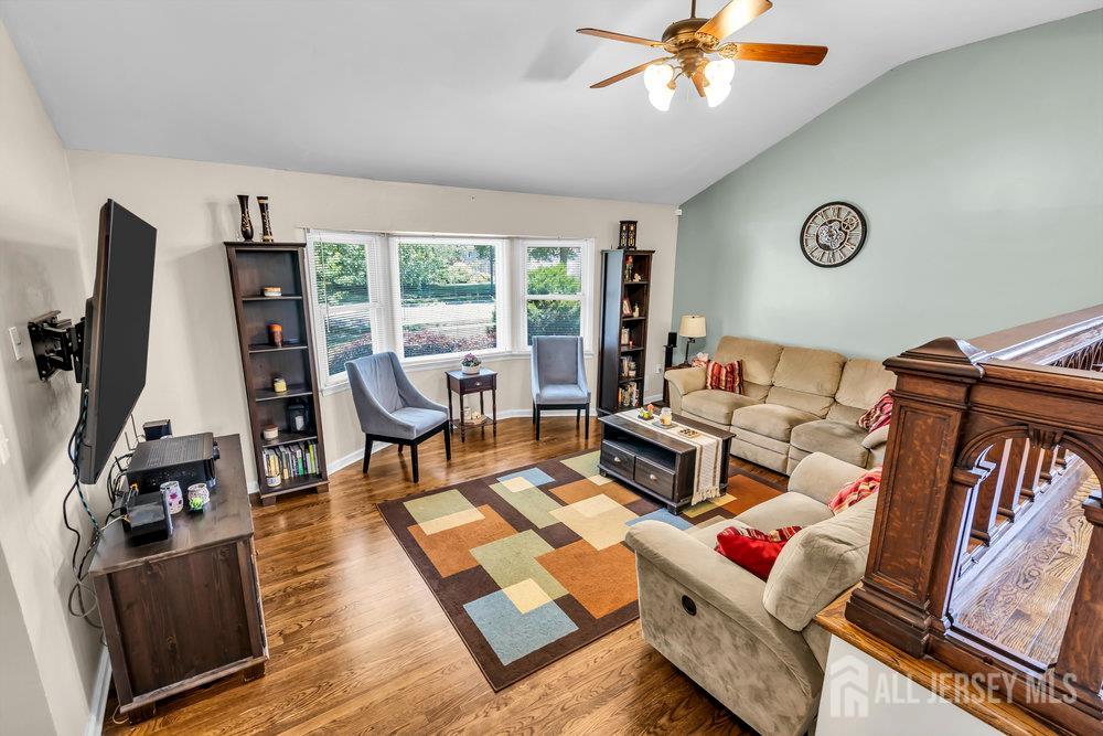 14 Academic Road East Brunswick, NJ 08816 - Photo 8 of 28 a living room with furniture and a flat screen tv