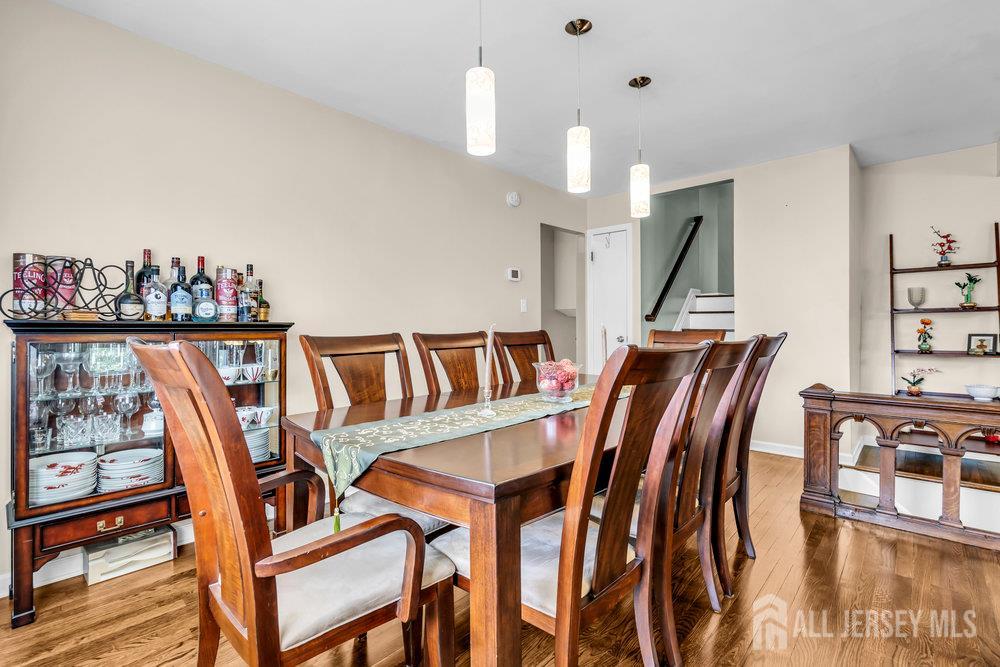 14 Academic Road East Brunswick, NJ 08816 - Photo 9 of 28 a dining room with furniture and wooden floor