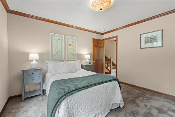 a spacious bedroom with a bed and a table
