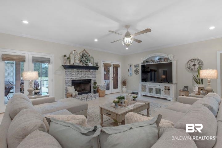 24541 Baldwin Beach Expressway Robertsdale, AL 36567 - Photo 7 of 51 Tiled living area featuring crown molding, ceiling fan, recessed lighting, and a brick fireplace
