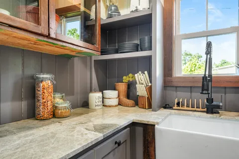 a kitchen with a sink and a refrigerator