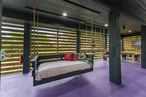 a bedroom with furniture and a window