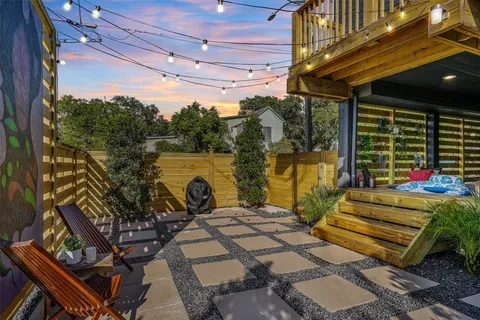a view of a patio with a table chairs and a patio
