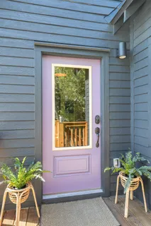 a porch with a table and chair