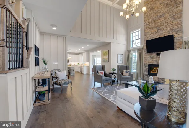 a living room with fireplace furniture and a flat screen tv