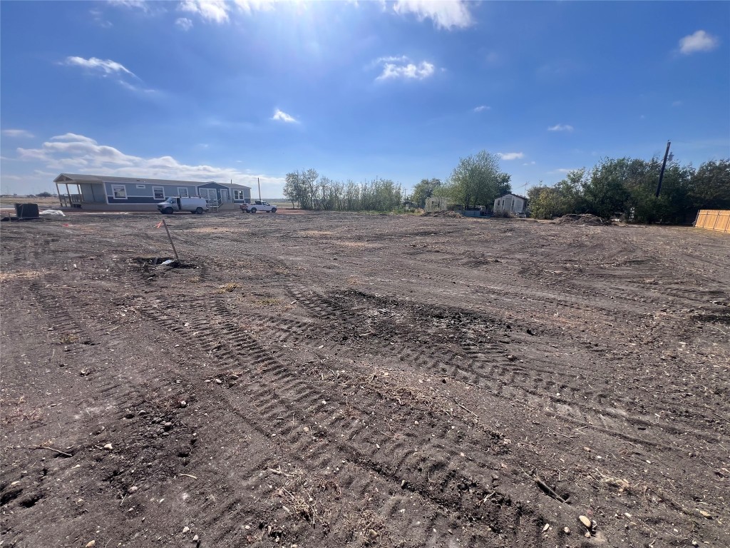 704 East Pecan Granger, TX 76530 - Photo 8 of 11 a view of a dry yard with trees