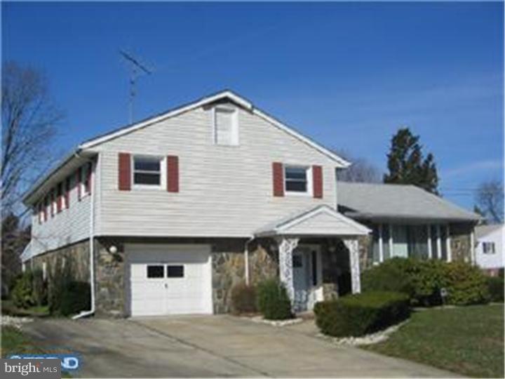 7 Greentree Road Hamilton, NJ 08619 - Photo 1 of 18 a front view of a house with a yard
