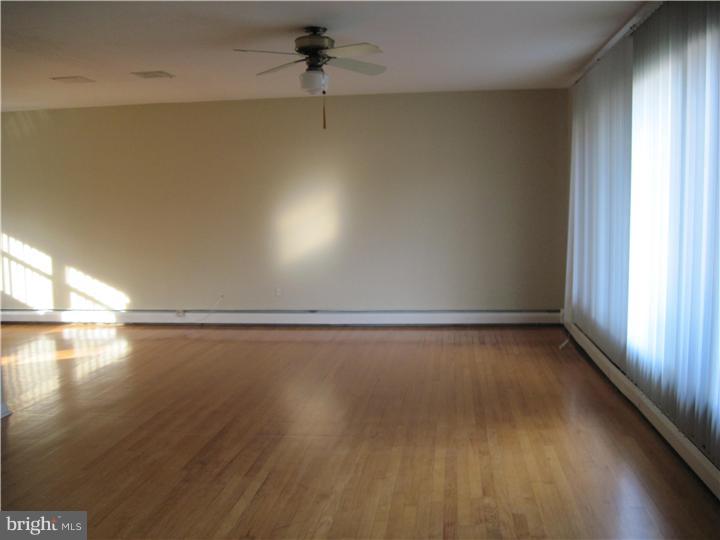 7 Greentree Road Hamilton, NJ 08619 - Photo 12 of 18 a view of a room with wooden floor and windows