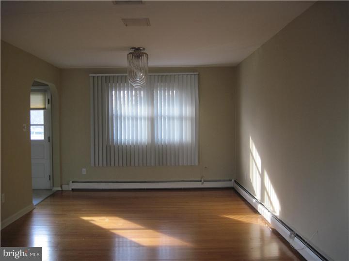 7 Greentree Road Hamilton, NJ 08619 - Photo 14 of 18 an empty room with wooden floor and windows