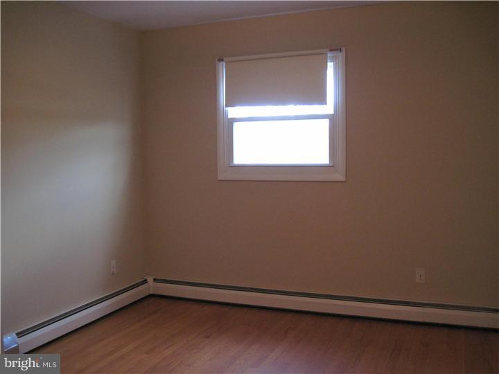 7 Greentree Road Hamilton, NJ 08619 - Photo 16 of 18 a view of a small space with wooden floor and a window