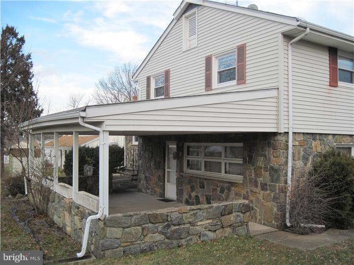 7 Greentree Road Hamilton, NJ 08619 - Photo 3 of 18 a view of white house with large windows and a small yard