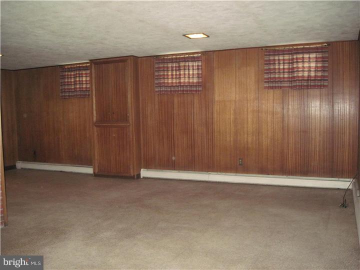 7 Greentree Road Hamilton, NJ 08619 - Photo 7 of 18 an empty room with wooden floor