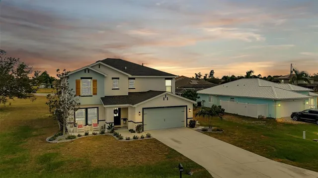 a view of a house with a yard