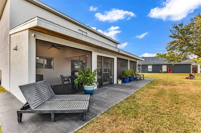 a front view of house with deck and outdoor seating