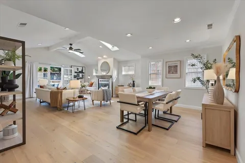 a view of a house with a yard and sitting area