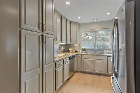 a view of a white house with a patio