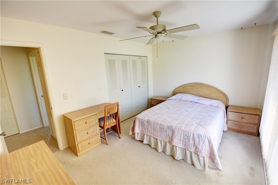 6790 Harmony Road North Port, FL 34287 - Photo 14 of 20 a bedroom with a bed and closet