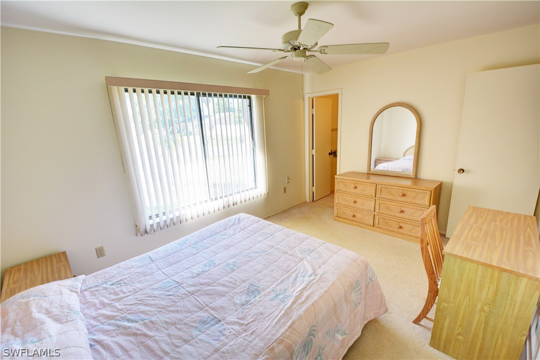 6790 Harmony Road North Port, FL 34287 - Photo 15 of 20 a bedroom with a bed and a dresser