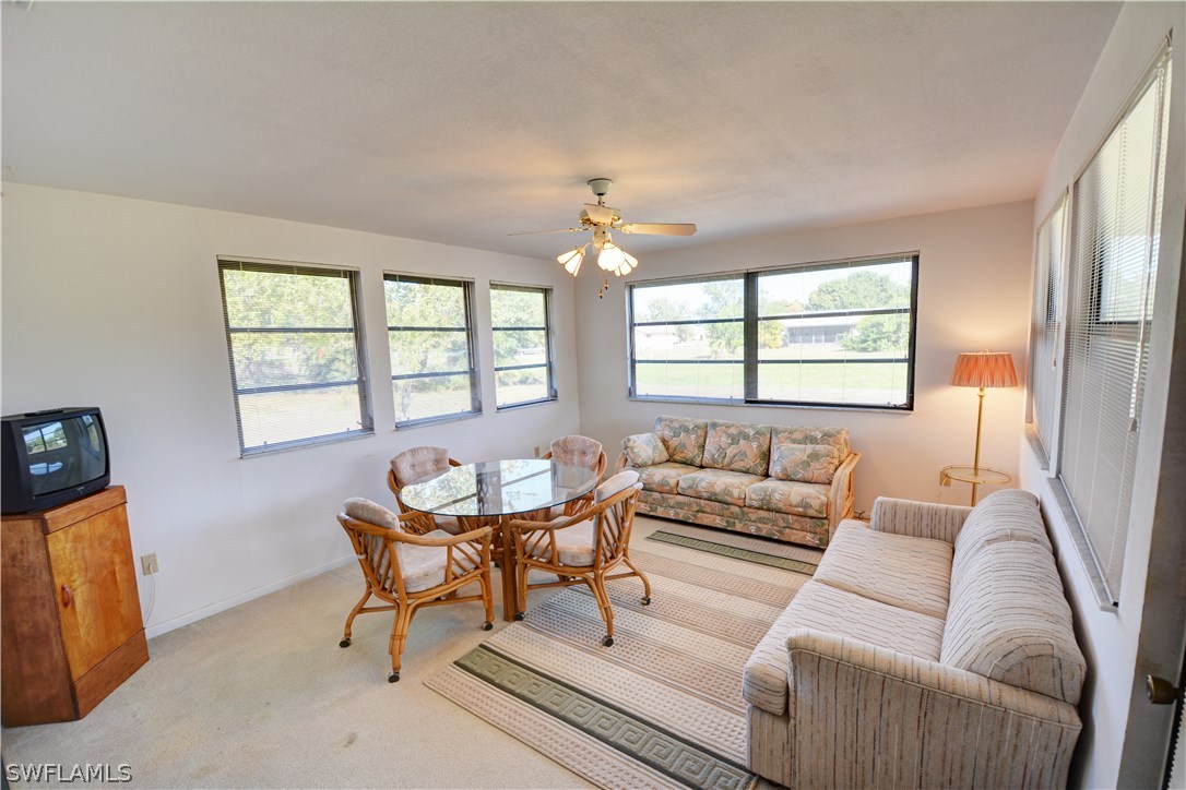 6790 Harmony Road North Port, FL 34287 - Photo 17 of 20 a living room with furniture and a large window
