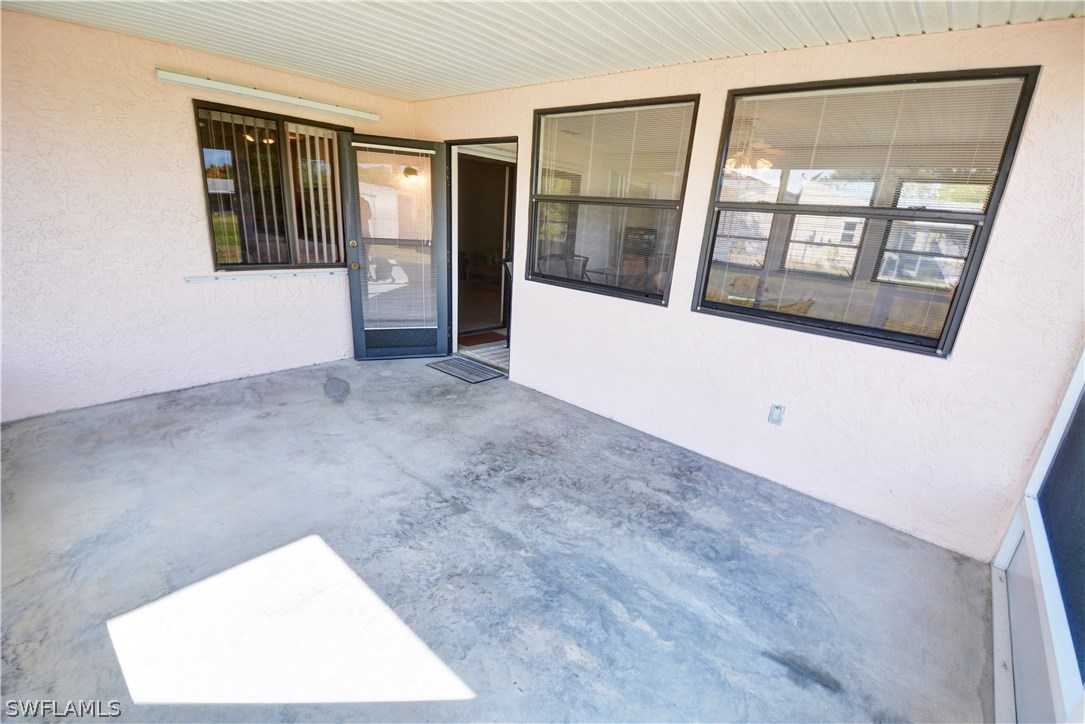 6790 Harmony Road North Port, FL 34287 - Photo 20 of 20 an empty room with windows