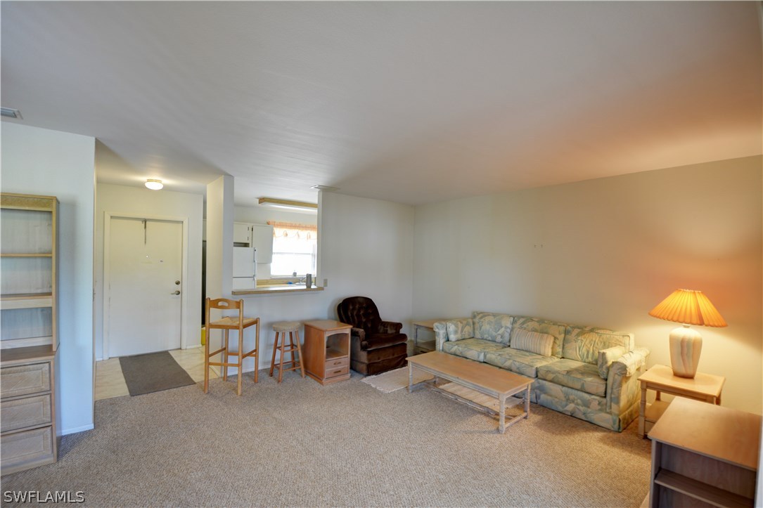6790 Harmony Road North Port, FL 34287 - Photo 3 of 20 a bedroom with furniture and a lamp