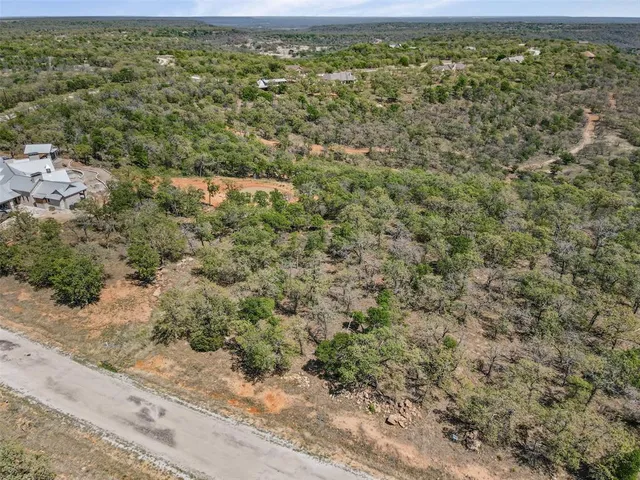 a view of a house with swimming pool and sitting area